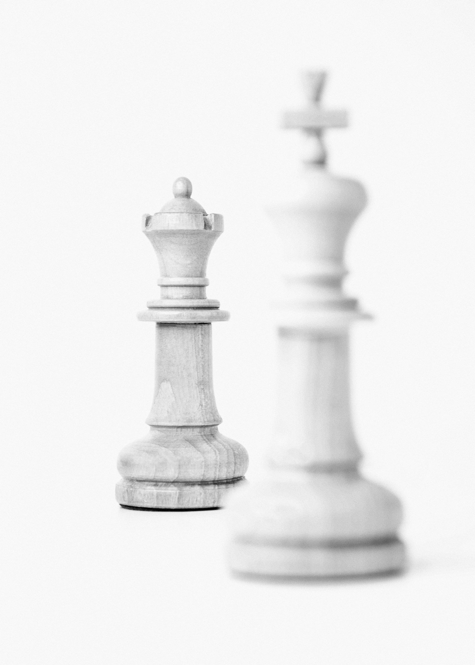 Two chess pieces facing each other in black and white